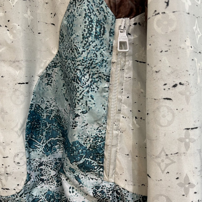 Close-up detail shot of Louis Vuitton luxury clothing with monogram-inspired silhouette