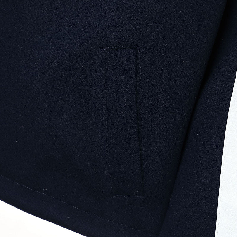 Flat lay presentation of Louis Vuitton luxury clothing with label-forward styling