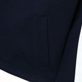 Flat lay presentation of Louis Vuitton luxury clothing with label-forward styling