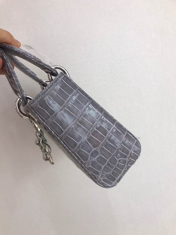 Styled lifestyle shot of signature sleek women's handbag – women's designer-style accessory