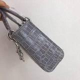 Styled lifestyle shot of signature sleek women's handbag – women's designer-style accessory