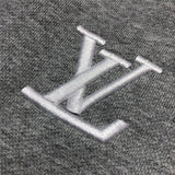 Flat lay presentation of Louis Vuitton cotton t-shirt with label-forward styling