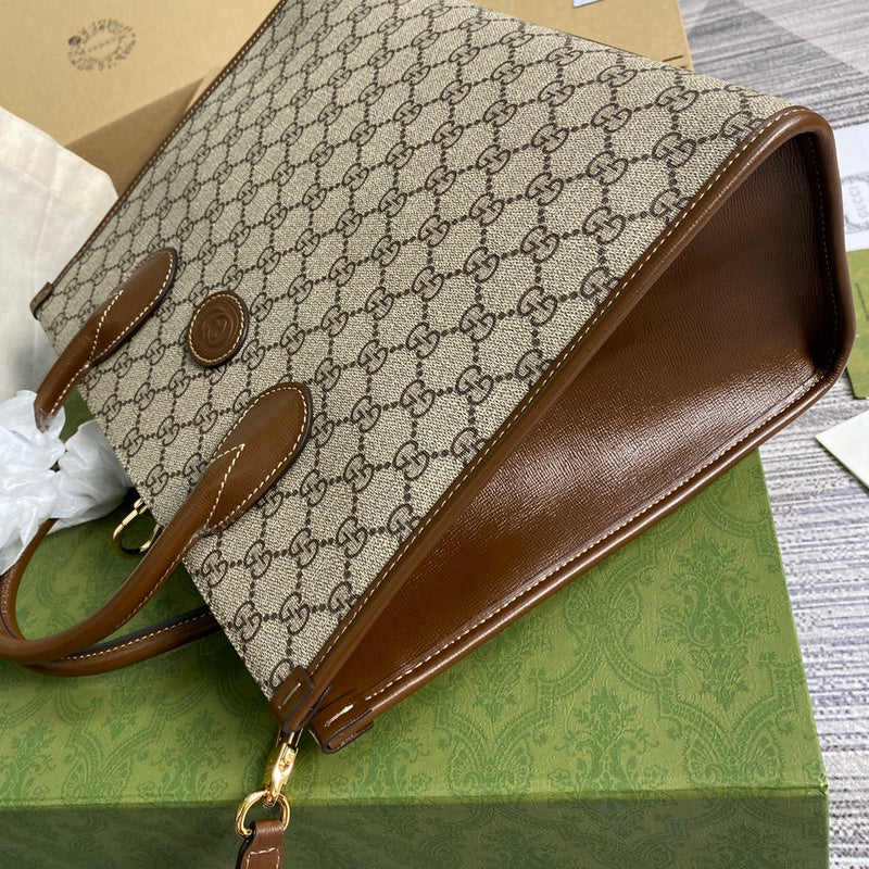 Side profile of signature polished women's handbag – women's designer-style accessory