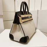  Structured carryall bag carried on shoulder