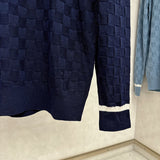 Front view of Louis Vuitton luxury clothing with signature branding