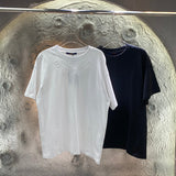 Close-up detail shot of Louis Vuitton cotton t-shirt with runway-inspired design