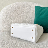 Styled lifestyle shot of everyday-luxe classic women's handbag – women's statement bag