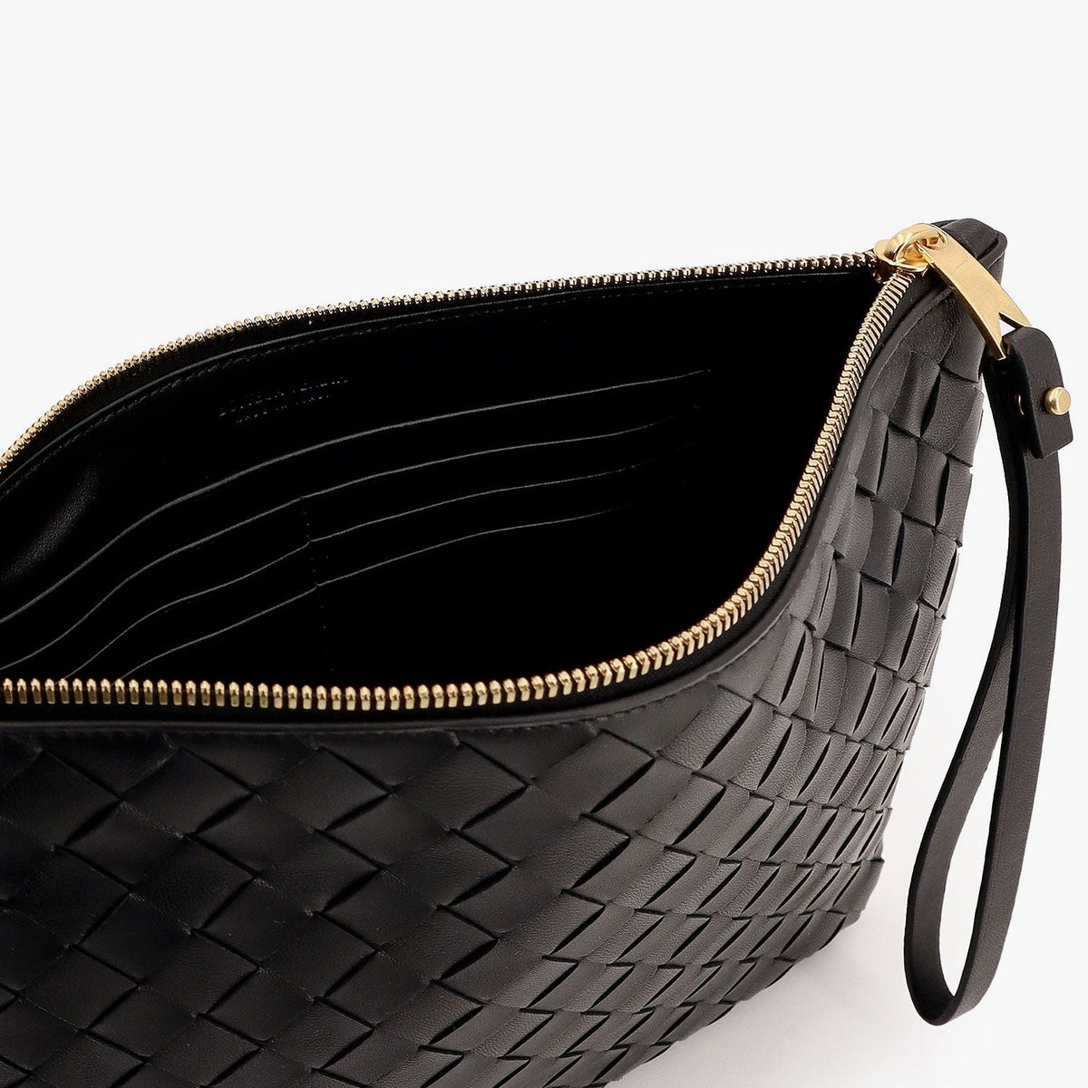 Close-up of Bottega Veneta pochettes hardware and fine stitching