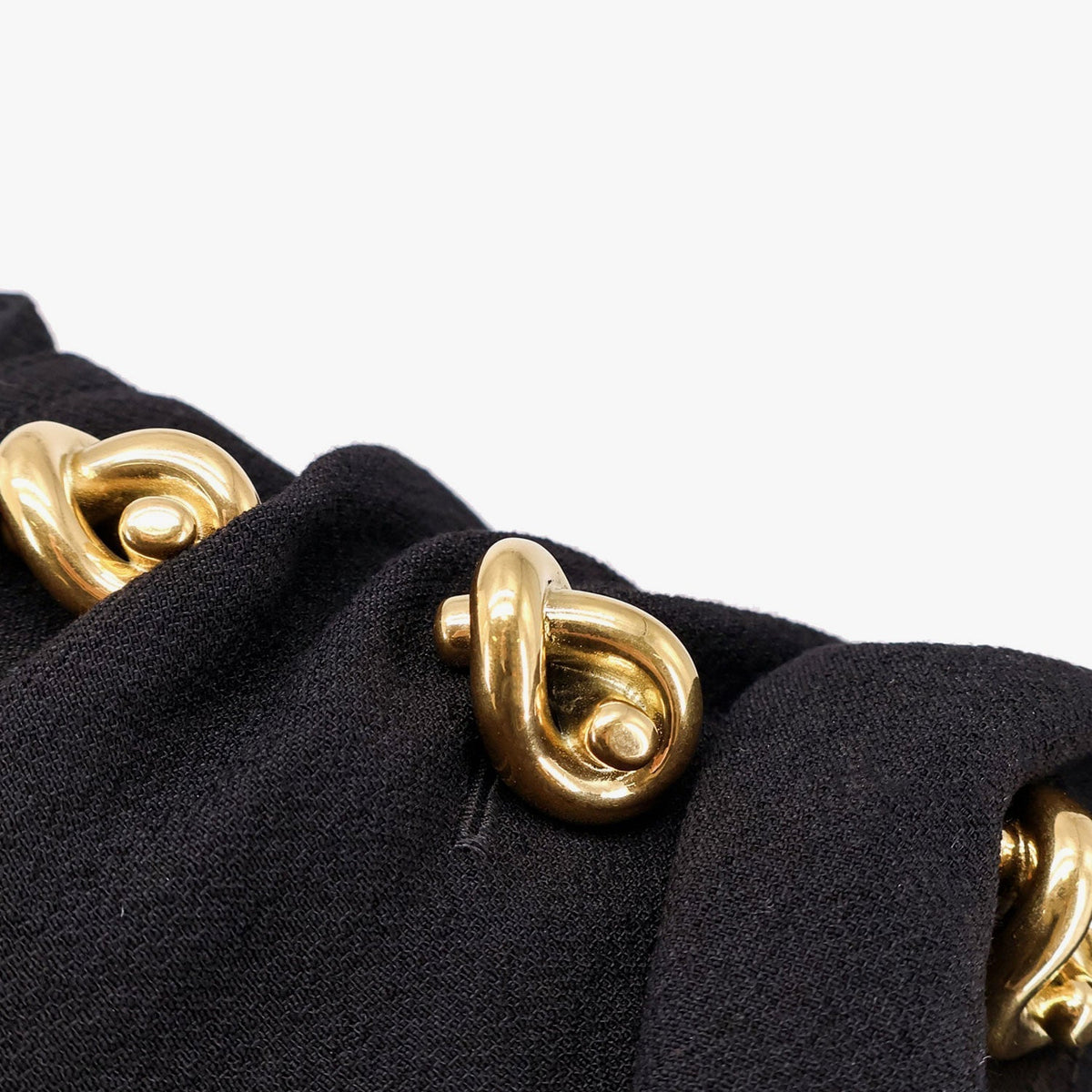 Close-up of Bottega Veneta t-shirts and top hardware and fine stitching