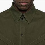 Close-up of Bottega Veneta blouses hardware and fine stitching