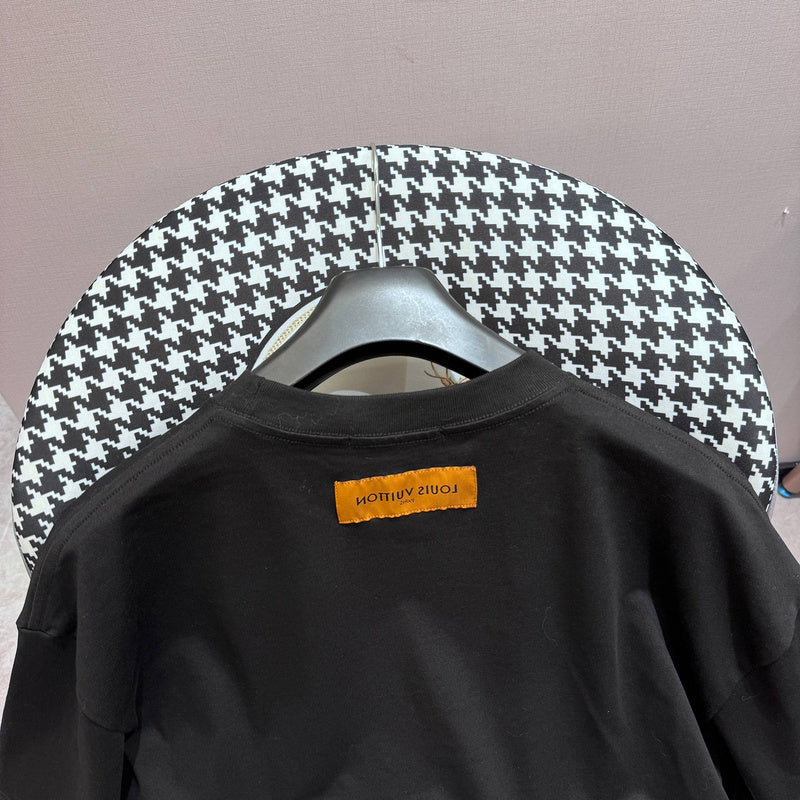 Flat lay presentation of Louis Vuitton cotton t-shirt with logo-detail design