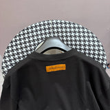 Flat lay presentation of Louis Vuitton cotton t-shirt with logo-detail design