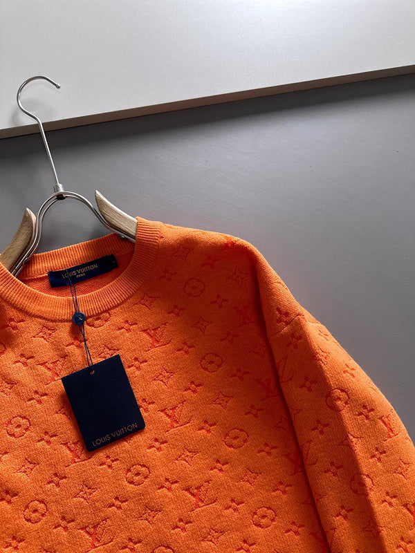 Full styled look of Louis Vuitton luxury clothing with label-forward styling