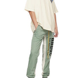 Front view of Rhude luxury clothing with monogram-inspired silhouette