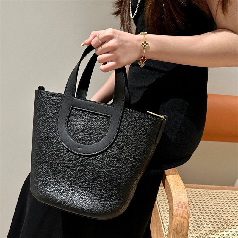  Signature carryall bag carried on shoulder
