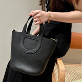  Signature carryall bag carried on shoulder