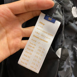 Flat lay presentation of Louis Vuitton luxury clothing with contemporary cut