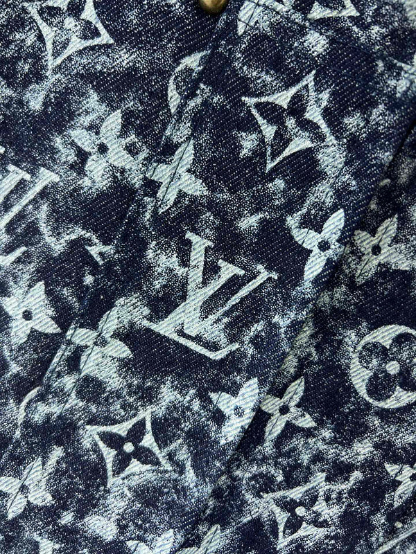 Flat lay presentation of Louis Vuitton luxury clothing with runway-inspired design