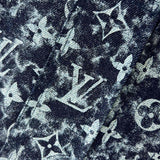 Flat lay presentation of Louis Vuitton luxury clothing with runway-inspired design