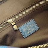 Side profile of sleek structured women's handbag – women's luxury accessory