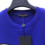 Flat lay presentation of Louis Vuitton luxury clothing with runway-inspired design
