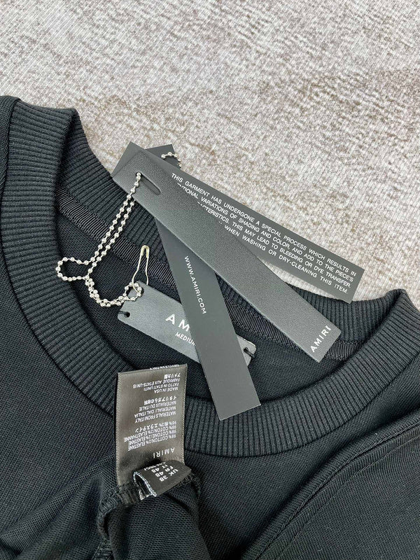 Texture and finish detail of Amiri luxury piece style No.094