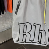 Flat lay presentation of Rhude luxury clothing with runway-inspired design