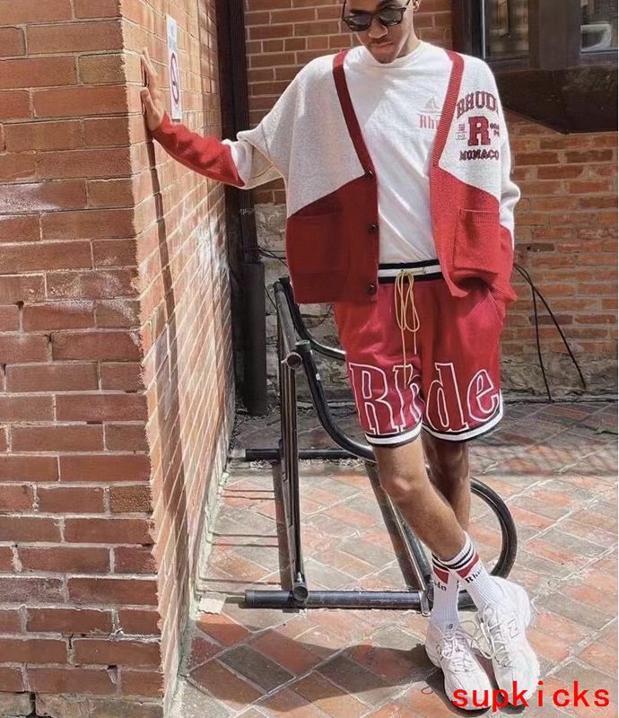 Flat lay presentation of Rhude luxury clothing with monogram-inspired silhouette