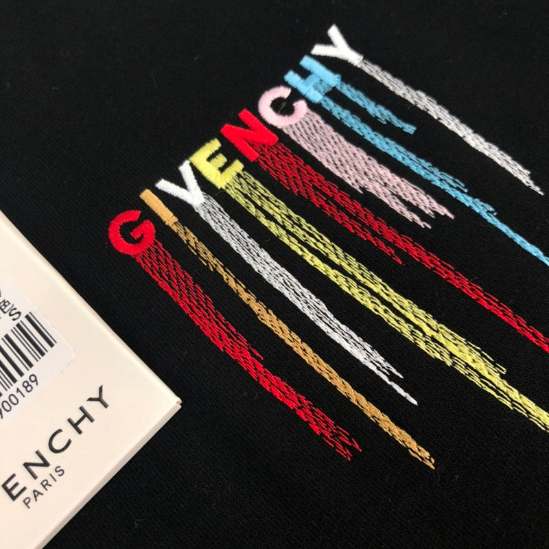Flat lay presentation of Givenchy luxury clothing with contemporary cut