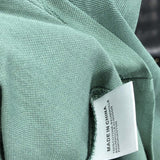 Side profile of Moncler luxury clothing with relaxed-fit cut