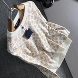 Flat lay presentation of Louis Vuitton luxury clothing with logo-detail design