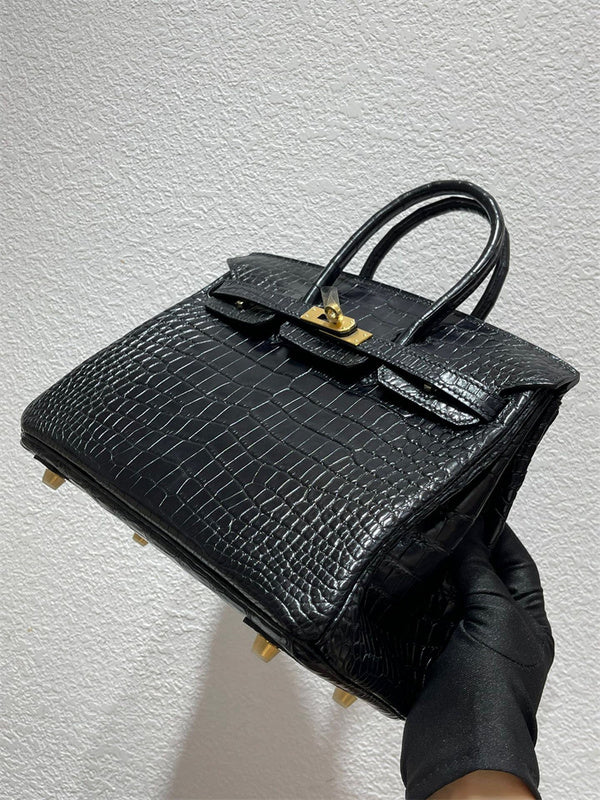  Signature tote bag carried on shoulder