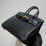  Signature tote bag carried on shoulder
