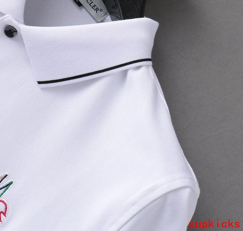 Flat lay presentation of Moncler luxury clothing with logo-detail design