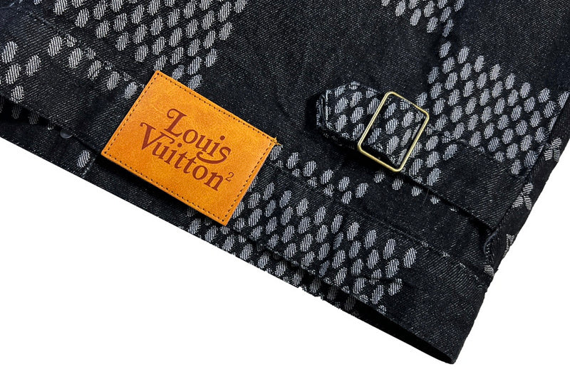 Flat lay presentation of Louis Vuitton luxury clothing with runway-inspired design