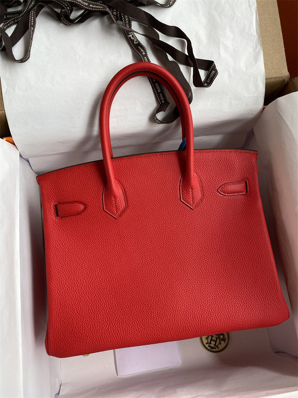 Side view of minimalist structured handbag