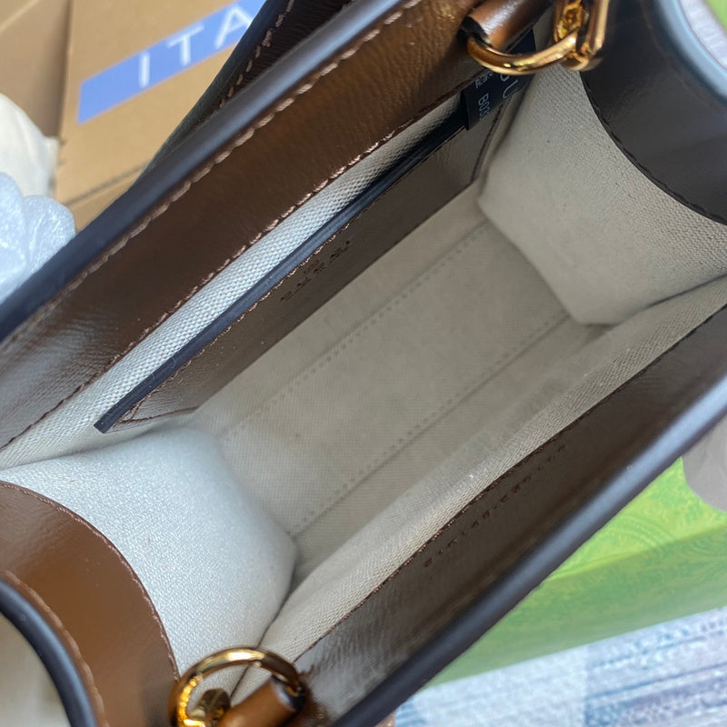 Side profile of polished signature women's handbag – women's premium purse