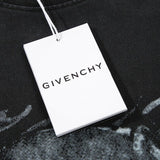 Flat lay presentation of Givenchy luxury clothing with signature branding