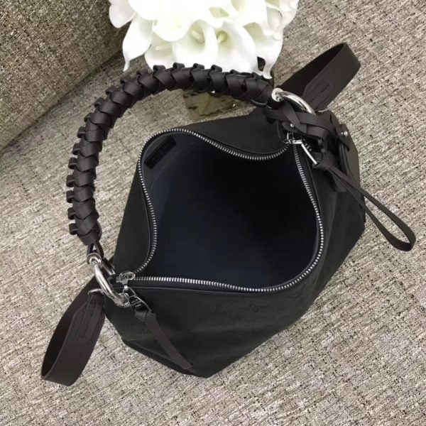 Top view of polished sleek women's handbag – women's luxury accessory