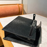 Side view of clean-lined structured handbag