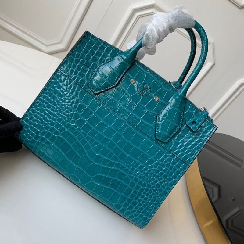 Handle and strap detail of modern polished women's handbag – women's statement bag