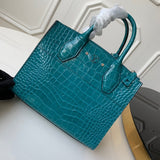 Handle and strap detail of modern polished women's handbag – women's statement bag