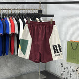 Side profile of Rhude luxury clothing with streetwear-inspired cut