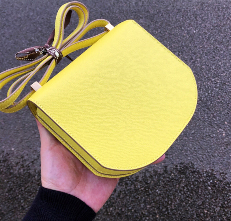 Side view of fluid structured handbag