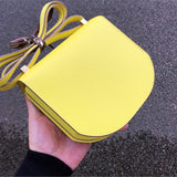 Side view of fluid structured handbag