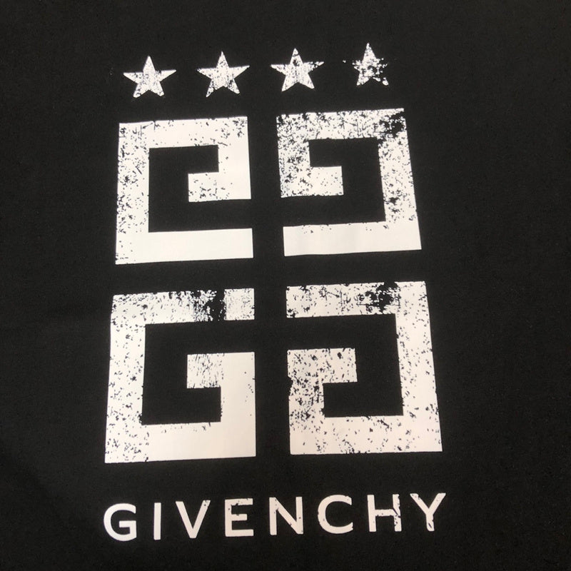 Flat lay presentation of Givenchy luxury clothing with tailored silhouette