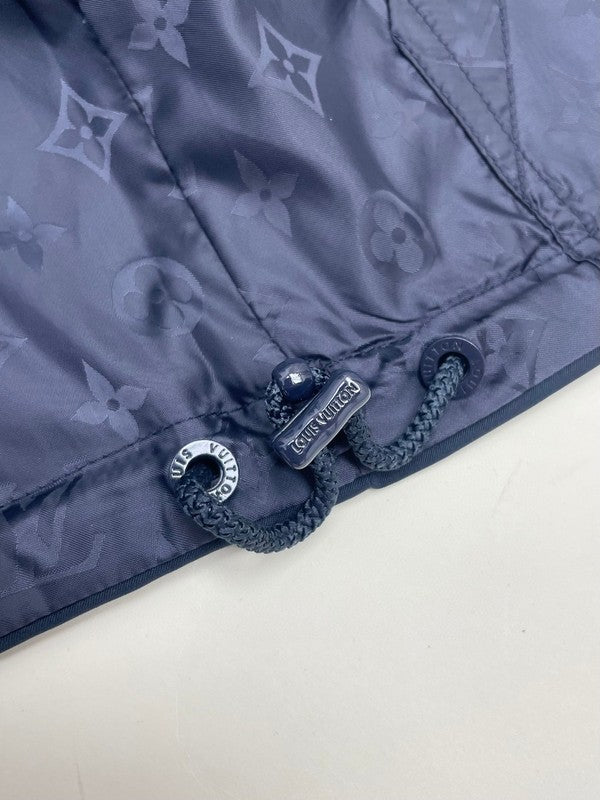 Flat lay presentation of Louis Vuitton luxury clothing with tailored silhouette