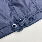 Flat lay presentation of Louis Vuitton luxury clothing with tailored silhouette