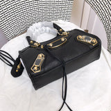 Styled lifestyle shot of statement structured women's handbag – women's statement bag