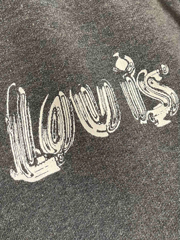 Flat lay presentation of Louis Vuitton luxury clothing with signature branding